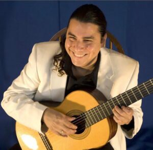 Edgar Cruz with a guitar